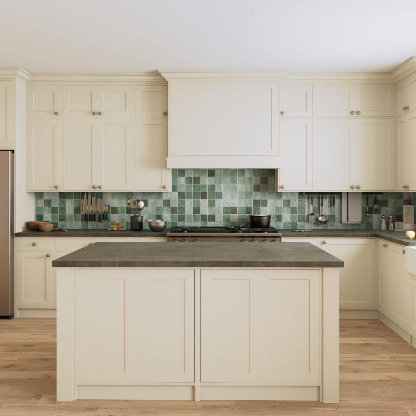 A modern kitchen with cream cabinets, a central island, a stainless steel refrigerator, green tiled backsplash, wooden floor, farmhouse sink, and large window letting in natural light.